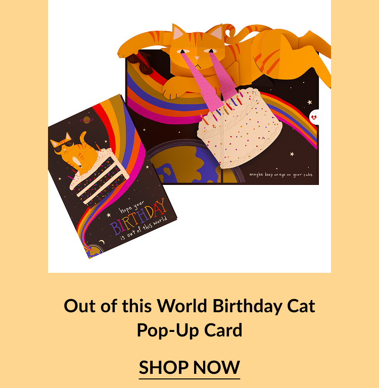 Pop-up card of an orange cat knocking over a birthday cake in space, with a rainbow trail and the message “Hope your birthday is out of this world.”