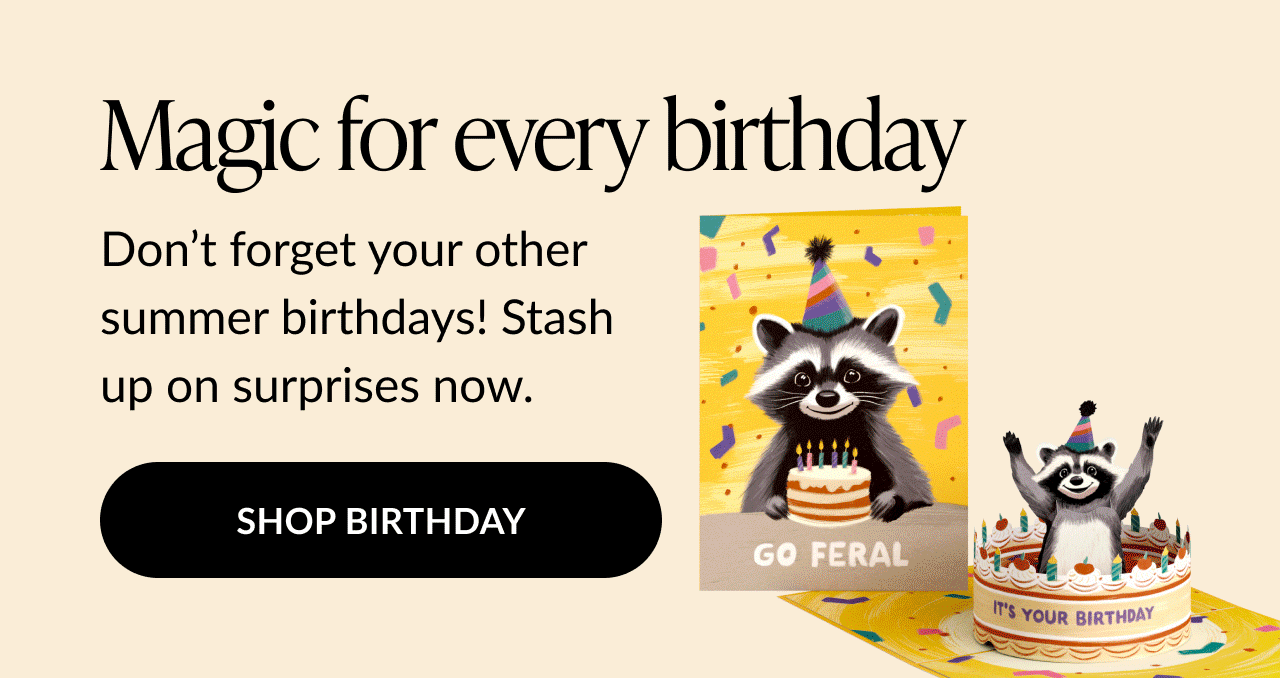 Pop-up birthday card featuring a raccoon in a party hat popping out of a cake, with the text “Go Feral” on the cover and “It’s Your Birthday” on the cake base.