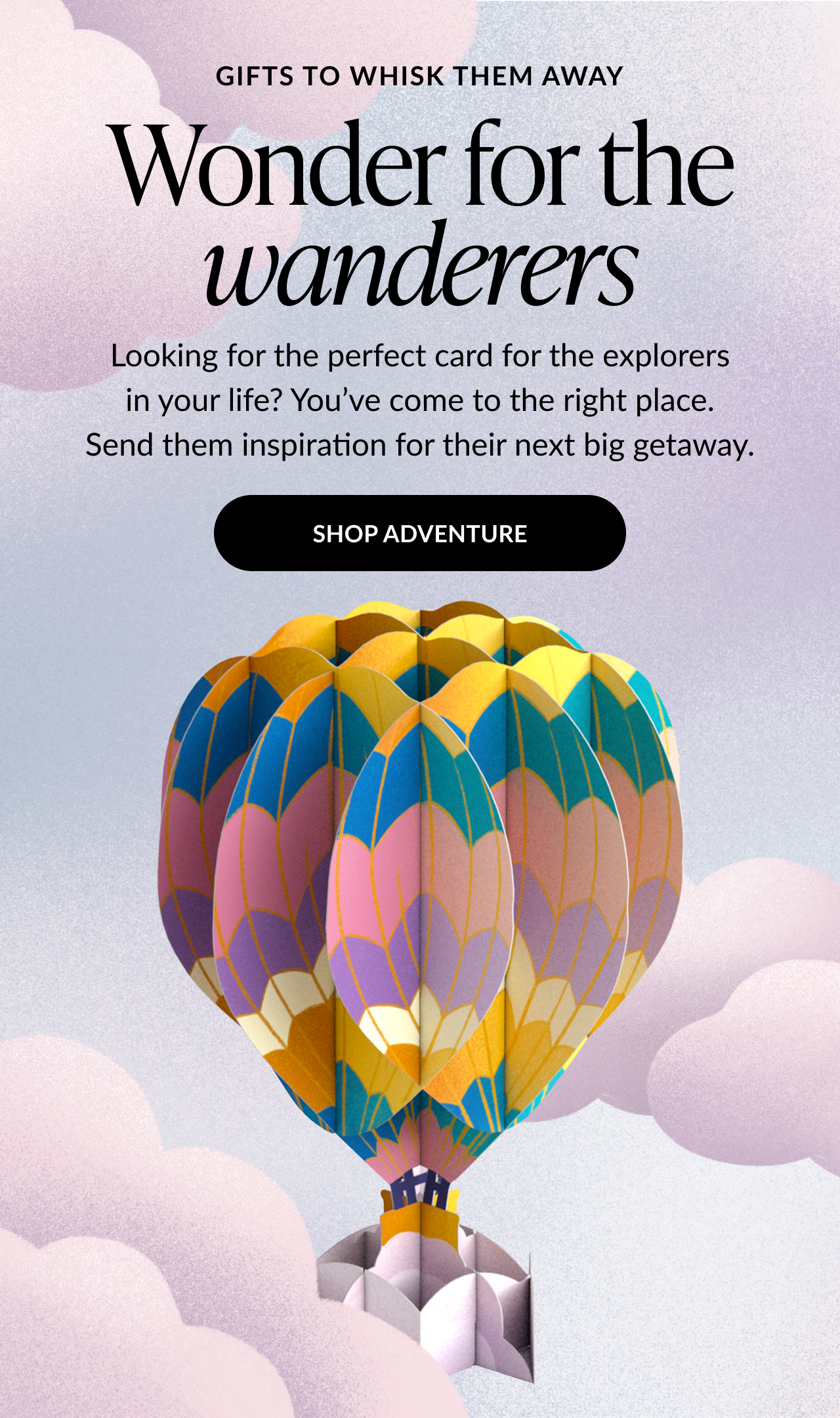 Hot air balloon pop-up card with colorful panels floating among clouds.