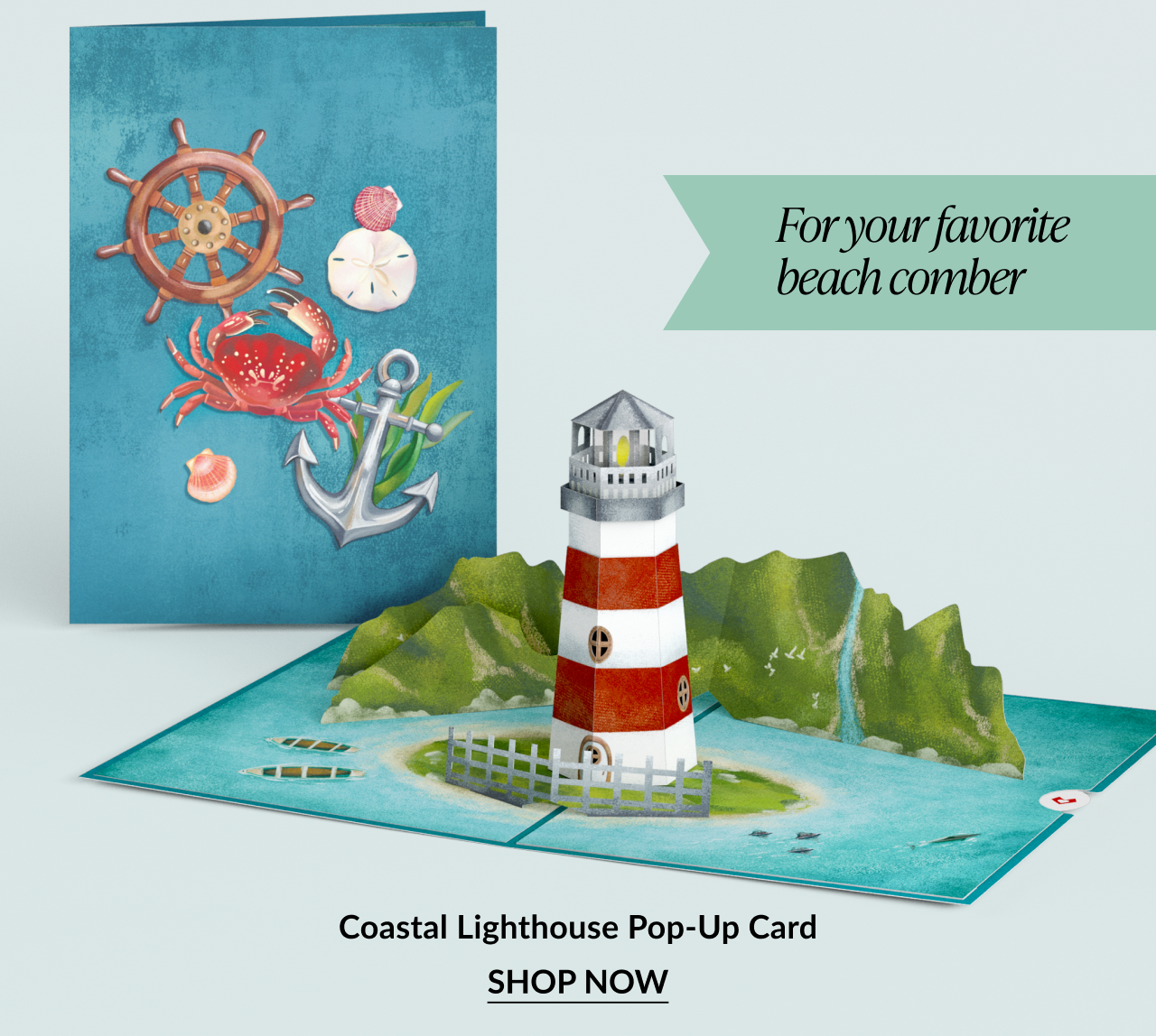 Pop-up card of a red and white lighthouse on a rocky island.