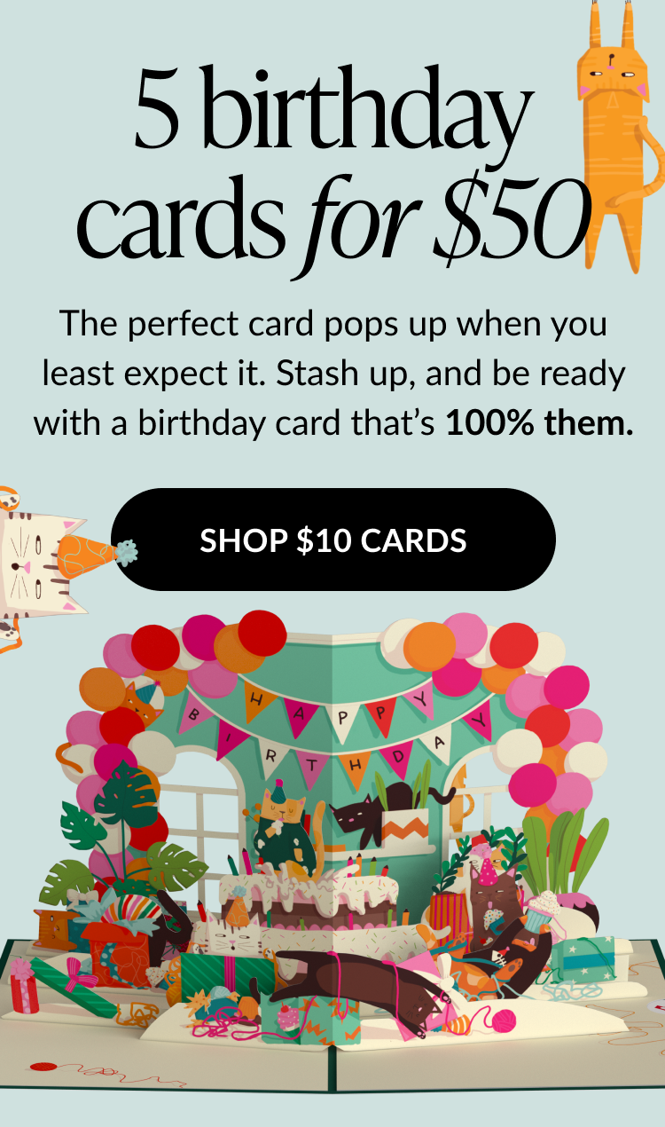 Pop-up card scene with colorful birthday decorations, cat characters, and gift boxes
