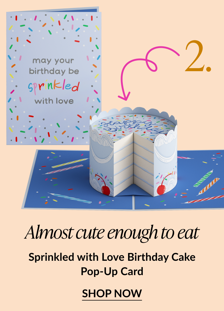 Pop-up birthday card shaped like a sprinkle-covered cake with lit candles