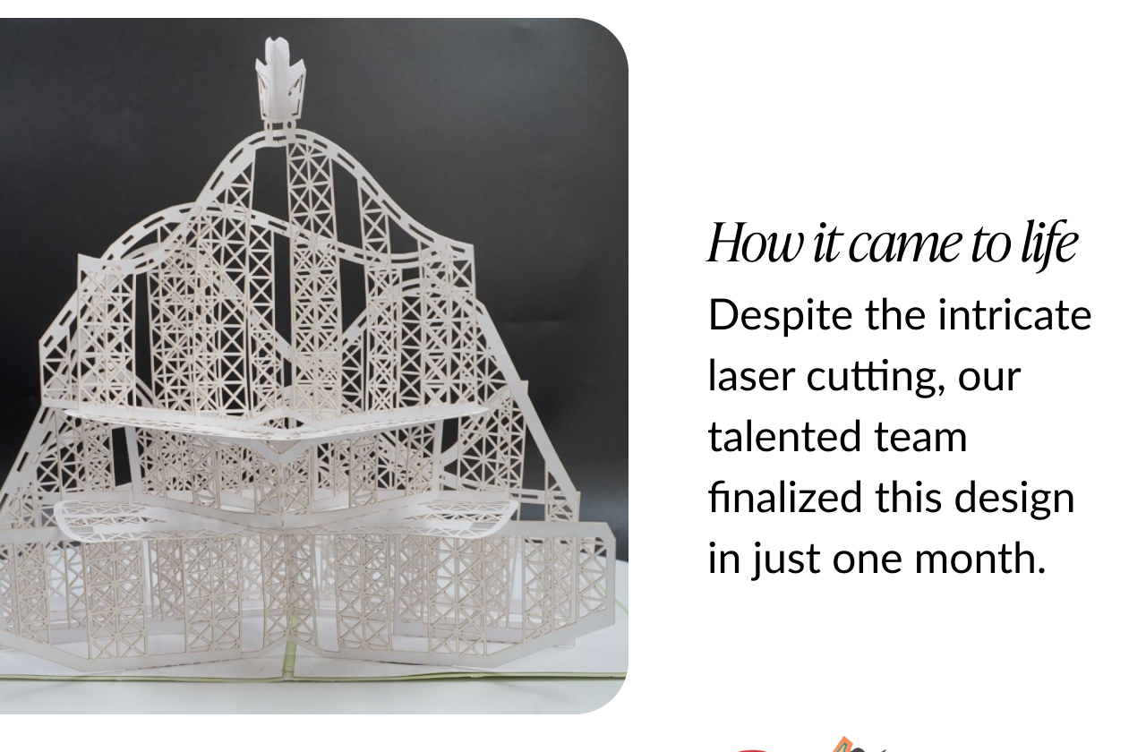 Unpainted paper prototype of the birthday rollercoaster pop-up card, showcasing the intricate laser-cut design.