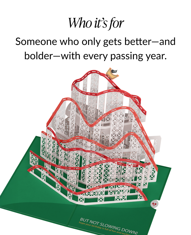 Fully assembled rollercoaster pop-up birthday card with a red track and a small birthday hat-wearing figure riding the coaster.