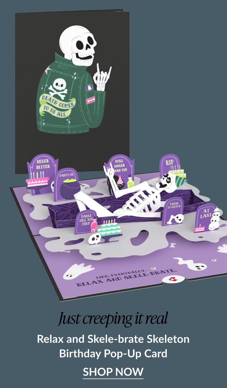 Relax and Skele-brate Skeleton Birthday pop-up card featuring a laid-back skeleton in a coffin surrounded by birthday decorations