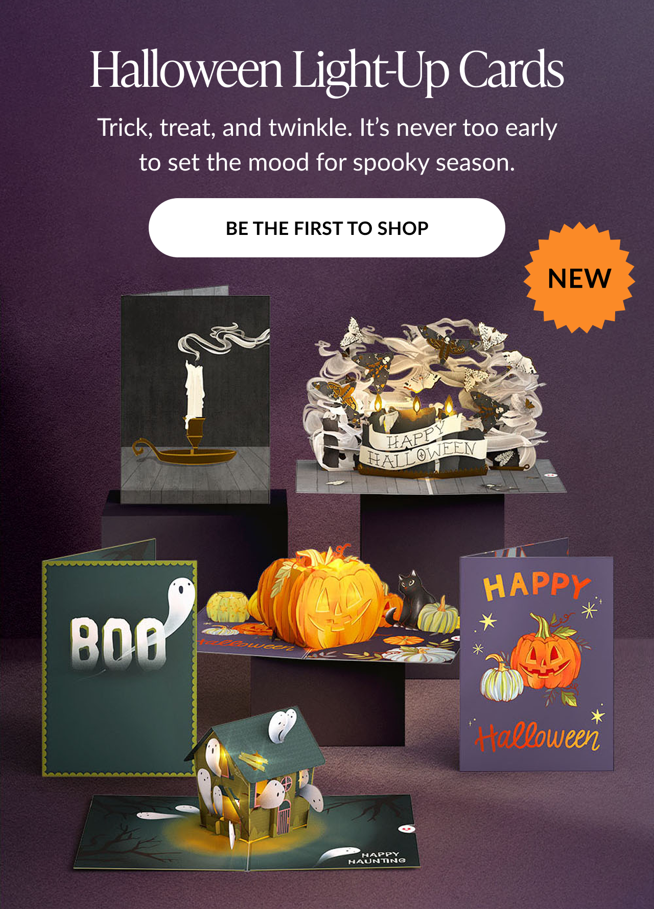 Collection of Halloween light-up pop-up cards including ghosts, pumpkins, haunted houses, and candles, all set against a purple backdrop