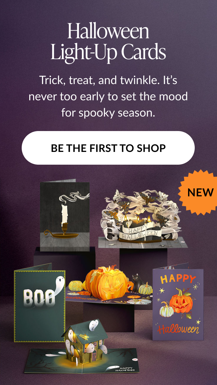 Collection of Halloween light-up pop-up cards including ghosts, pumpkins, haunted houses, and candles, all set against a purple backdrop