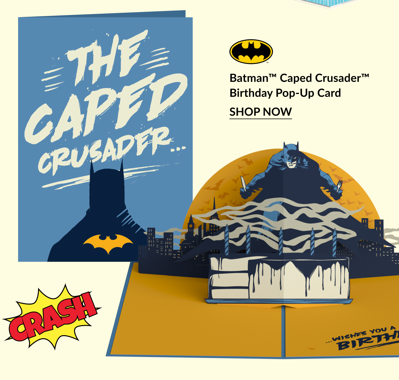 Batman Caped Crusader Birthday Pop-Up Card with a stylized blue cover, bat symbol, and a 3D Batman scene on a city rooftop, with “Crash!” text graphic and “Shop Now” button.
