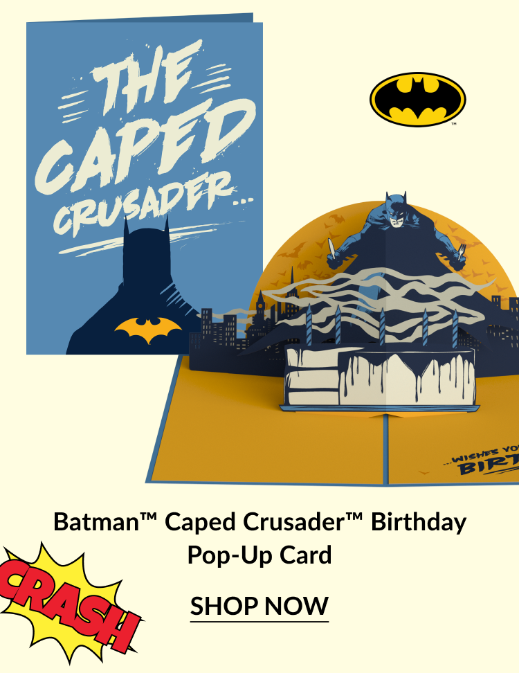 Batman Caped Crusader Birthday Pop-Up Card with a stylized blue cover, bat symbol, and a 3D Batman scene on a city rooftop, with “Crash!” text graphic and “Shop Now” button.