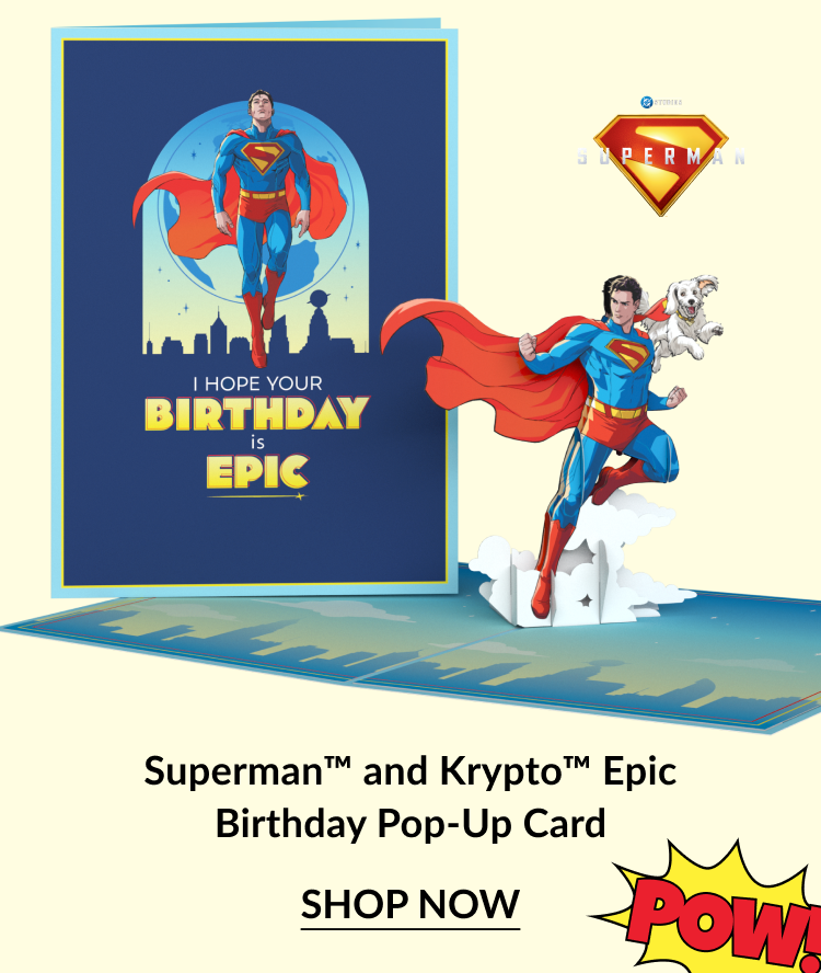 Superman and Krypto Epic Birthday Pop-Up Card with Superman and Krypto flying, accompanied by the message “I hope your birthday is epic” and a “Pow!” text graphic, with “Shop Now” button.