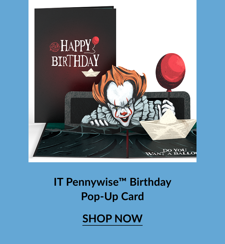 IT Pennywise Birthday Pop-Up Card with a black cover reading “Happy Birthday” in white and red text, and a 3D Pennywise figure emerging from a sewer holding a red balloon, with “Shop Now” button.