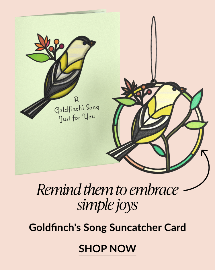 Goldfinch’s Song Suncatcher Card with a stained-glass style goldfinch perched on a branch, shown on both the card cover and as a hanging ornament, with “Shop Now” button.