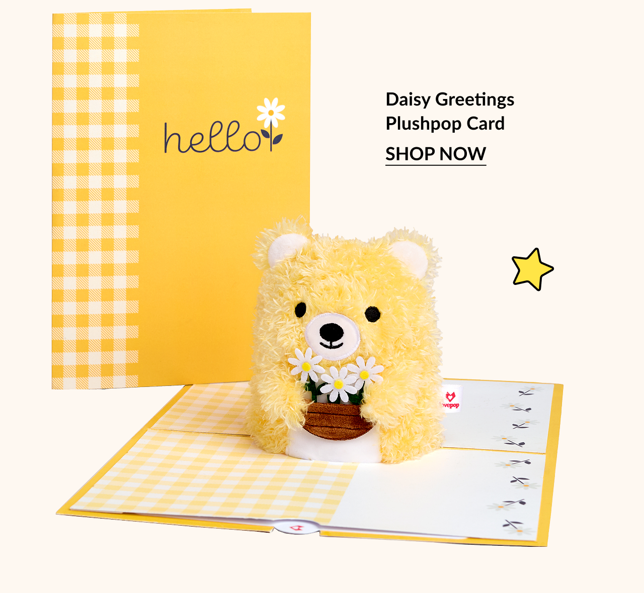 Yellow “hello” card with plushpop bear holding daisies.