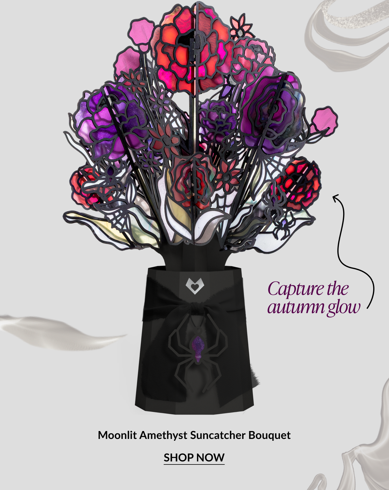 Moonlit Amethyst Suncatcher Bouquet featuring purple and red stained-glass-style flowers. CTA: Shop Now.