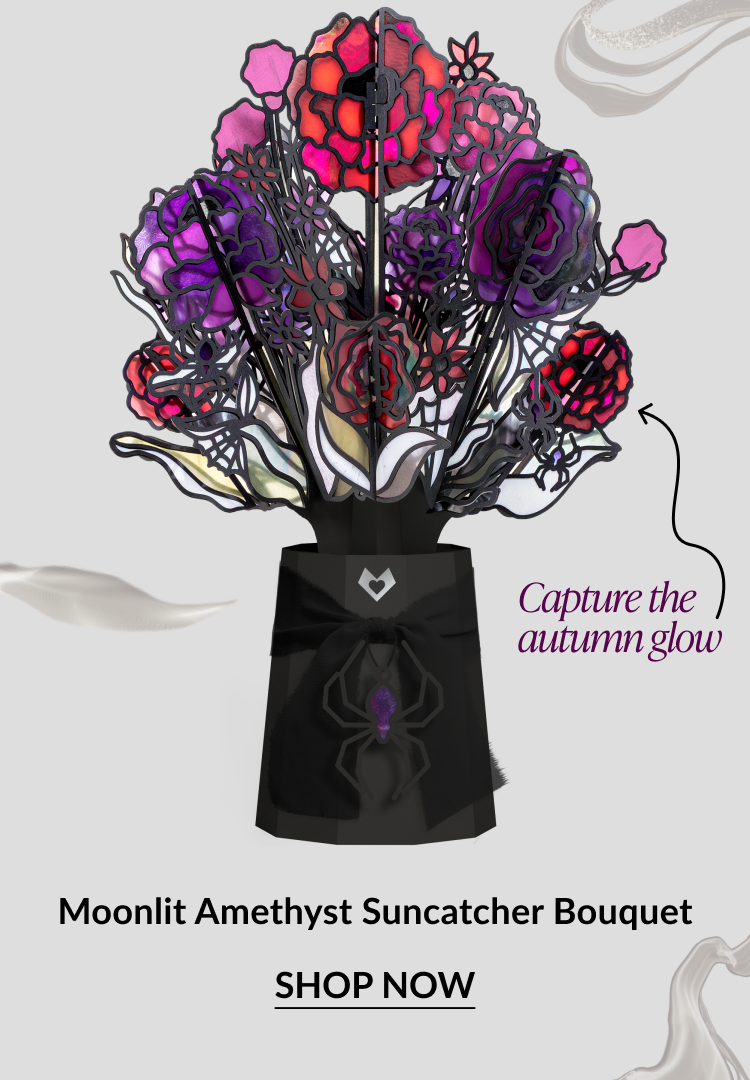 Moonlit Amethyst Suncatcher Bouquet featuring purple and red stained-glass-style flowers. CTA: Shop Now.