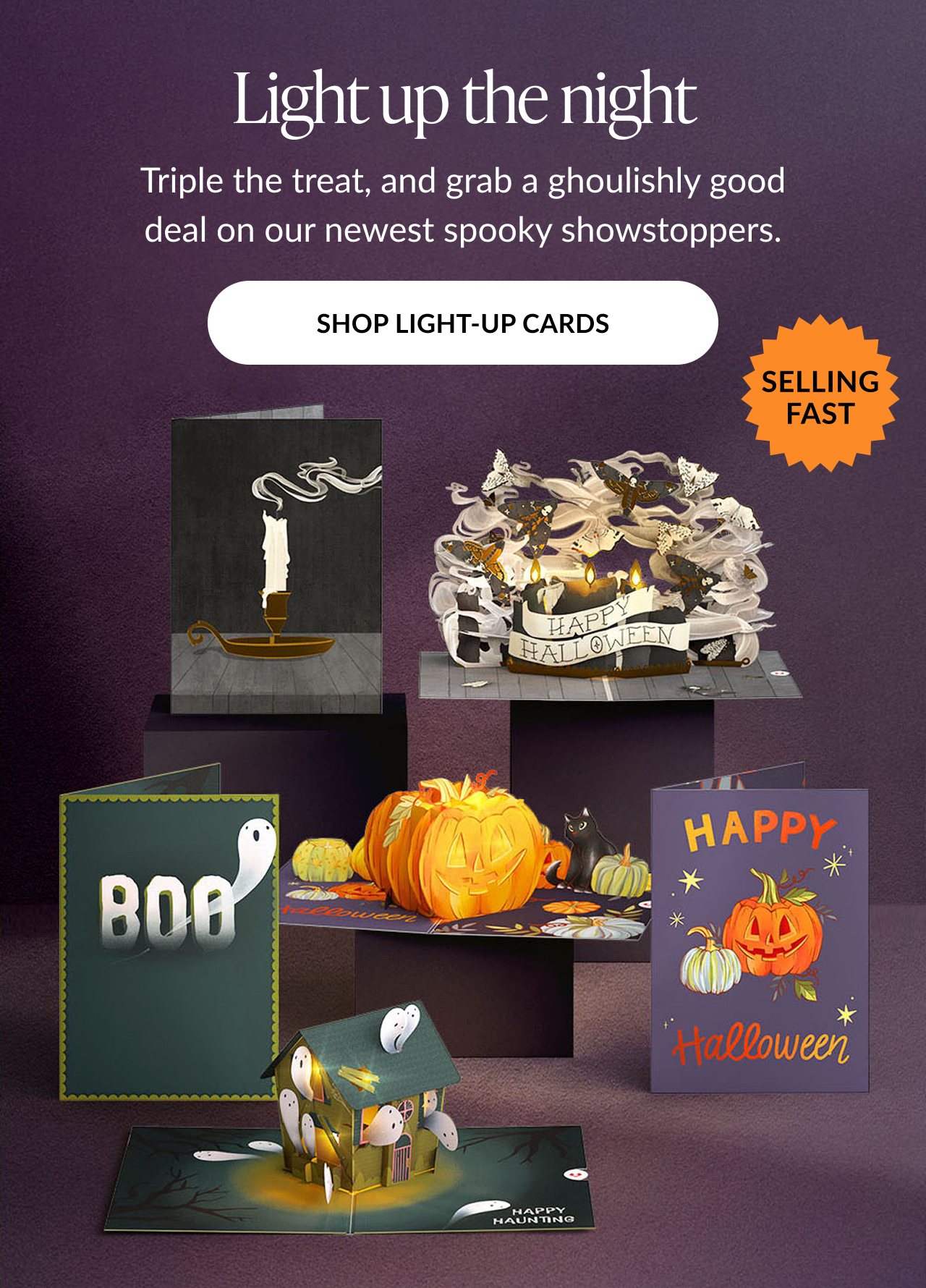 Light Up the Night section featuring illuminated Halloween pop-up cards, including pumpkins, ghosts, and Happy Halloween card. CTA: Shop Light-Up Cards.