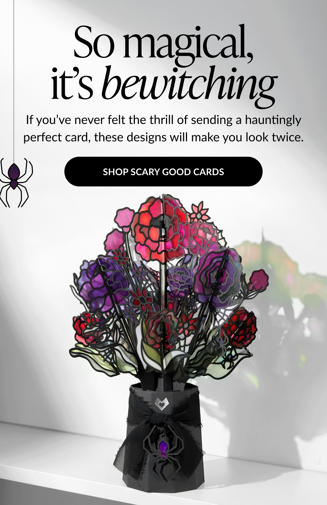 Halloween bouquet with purple and red stained-glass style flowers and spider bow