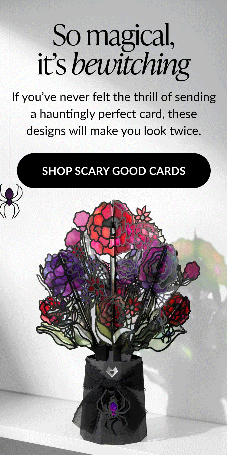 Halloween bouquet with purple and red stained-glass style flowers and spider bow