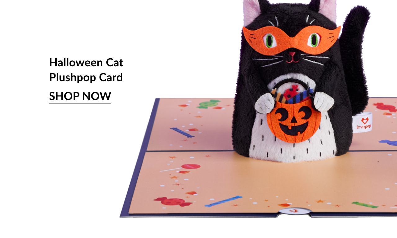 Halloween Cat Plushpop Card holding jack-o’-lantern candy bucket. Shop now.
