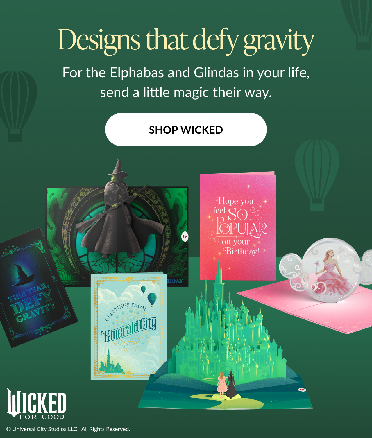 Wicked card collection featuring pop-ups of Elphaba Glinda and Emerald City Text says Designs that defy gravity send a little magic their way Button says Shop Wicked