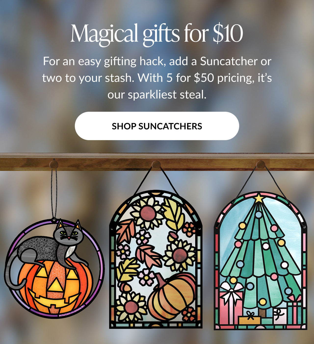 Magical gifts for $10 promotion featuring three suncatchers — a black cat on a pumpkin, fall leaves and sunflowers, and a Christmas tree — with Shop Suncatchers button
