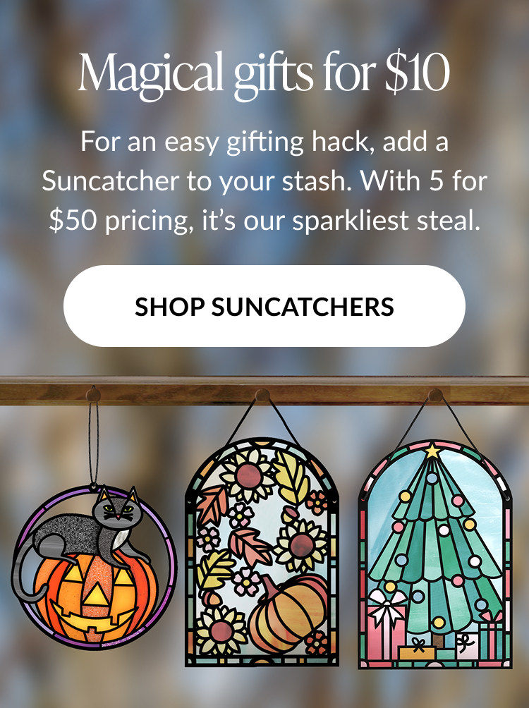 Magical gifts for $10 promotion featuring three suncatchers — a black cat on a pumpkin, fall leaves and sunflowers, and a Christmas tree — with Shop Suncatchers button