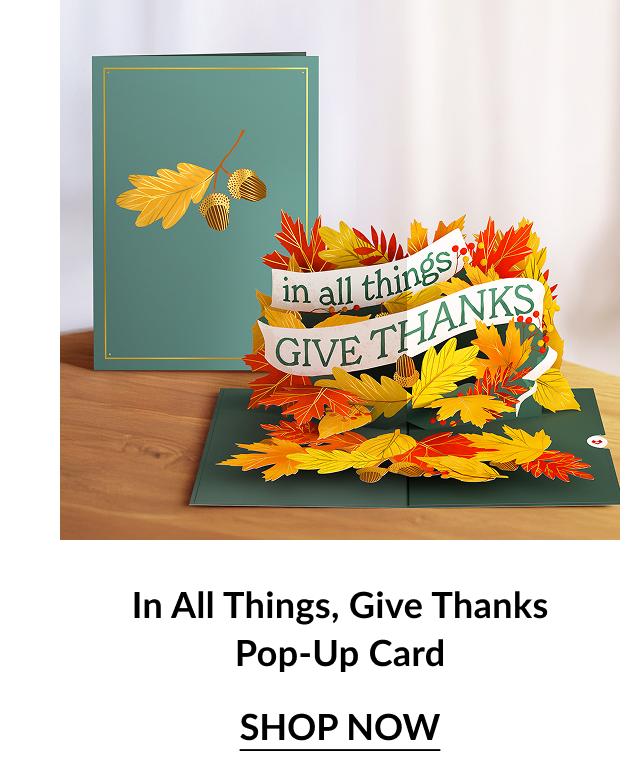 Green and gold card with autumn leaves; inside pop-up reads “in all things, GIVE THANKS” surrounded by colorful fall foliage.
