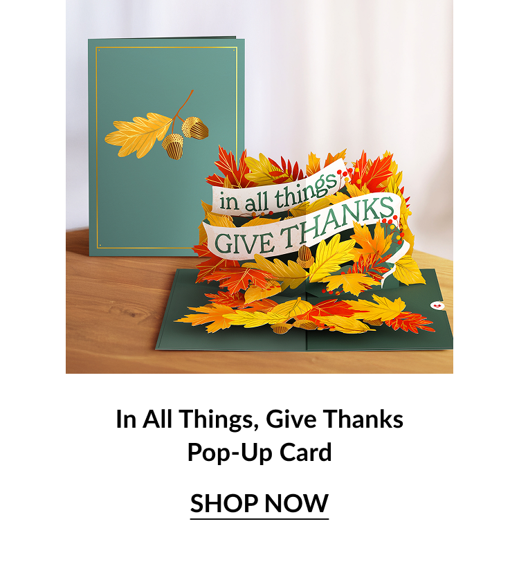 Green and gold card with autumn leaves; inside pop-up reads “in all things, GIVE THANKS” surrounded by colorful fall foliage.