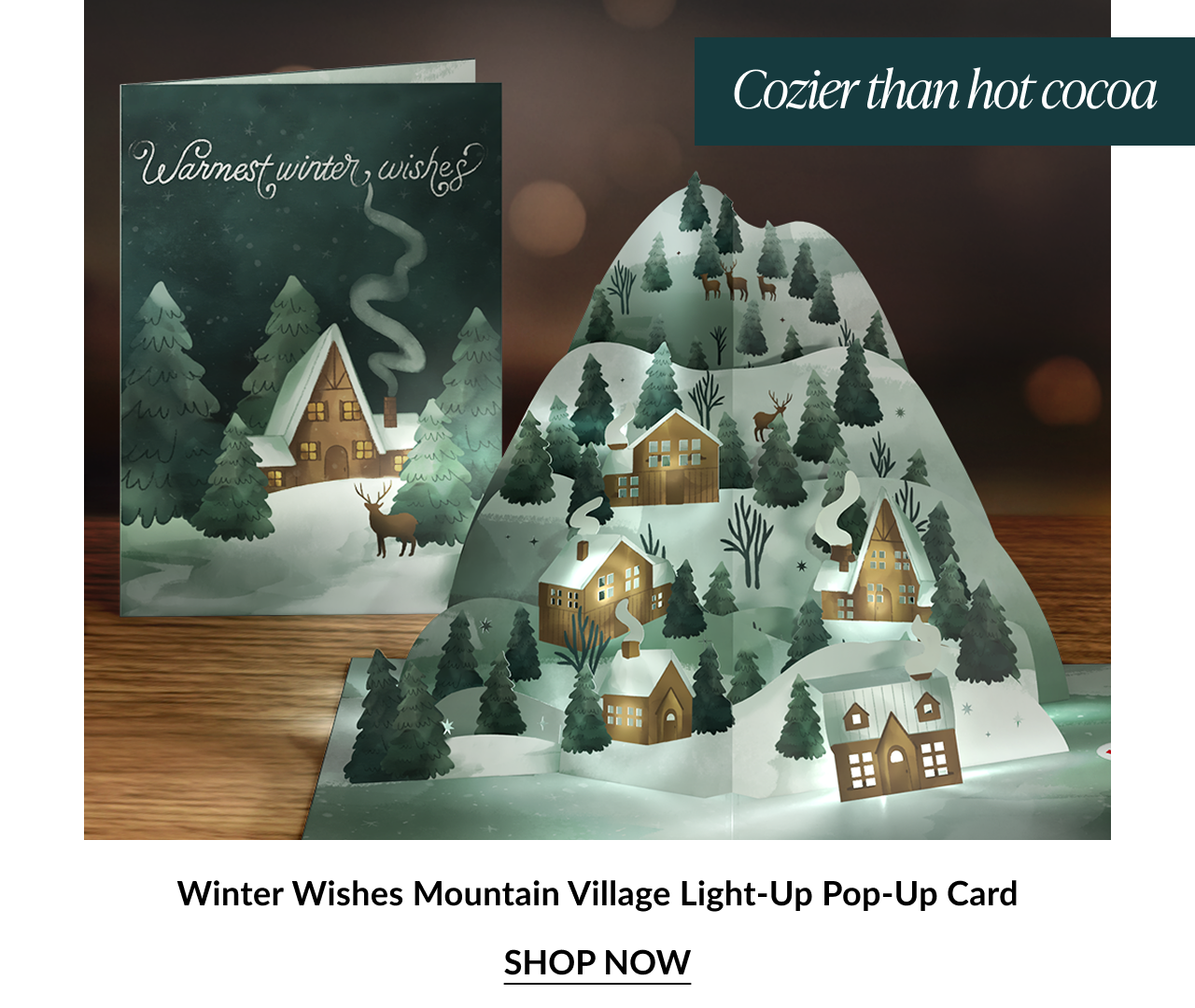 Winter village card with cozy cabin scene and light up pop up mountain