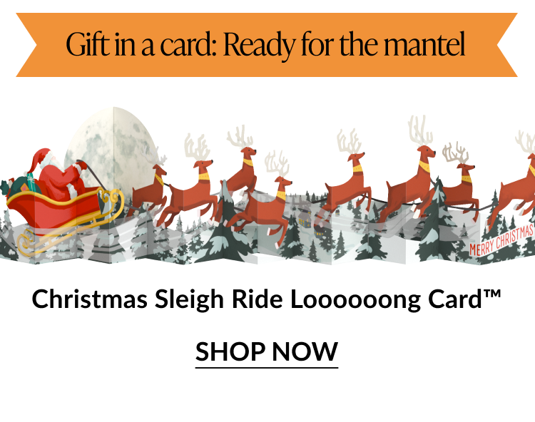 Christmas Sleigh Ride Loooooong Card showing Santa in his sleigh pulled by reindeer across a snowy forest scene with Gift in a card Ready for the mantel banner and Shop Now button
