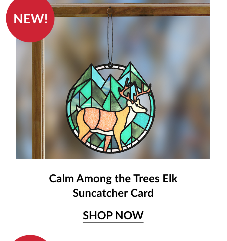 Calm Among the Trees Elk Suncatcher Card with a stained glass elk walking through geometric green trees