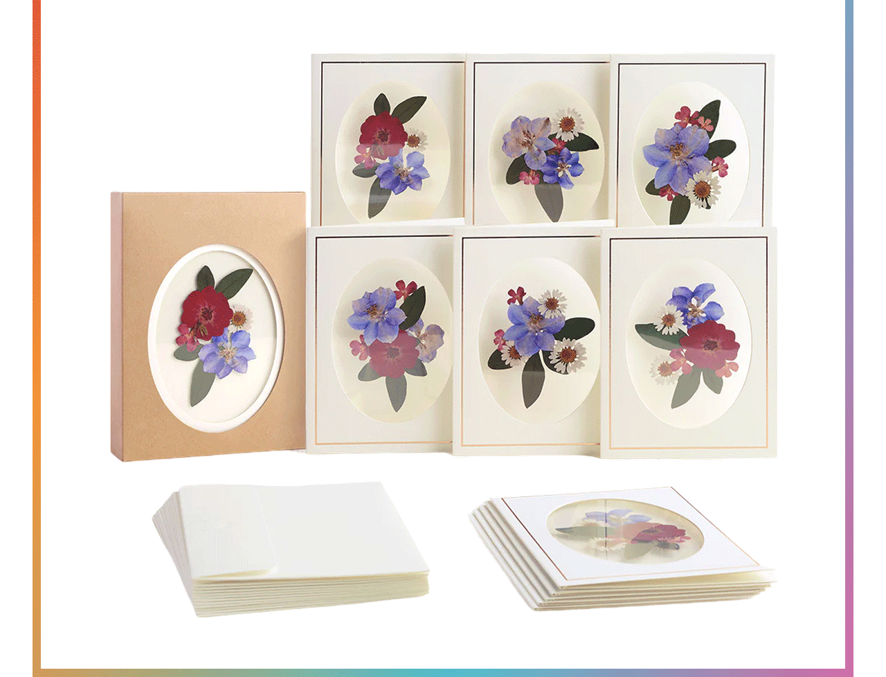 Pressed flower notecard box set with six assorted floral designs and coordinating envelopes displayed with kraft packaging and rainbow border trim