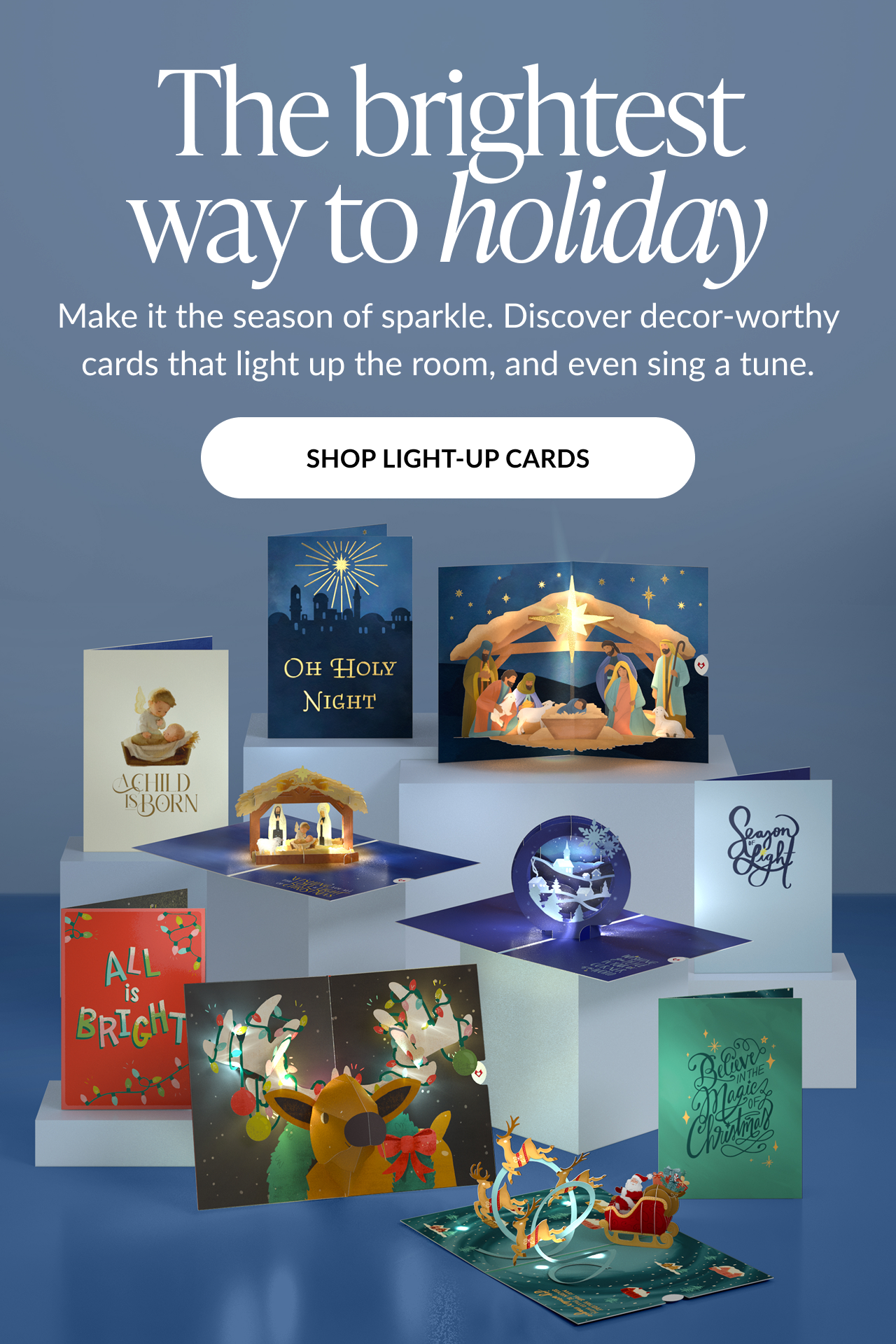 Blue background graphic with headline The brightest way to holiday featuring assortment of light up pop up cards and shop light up cards button