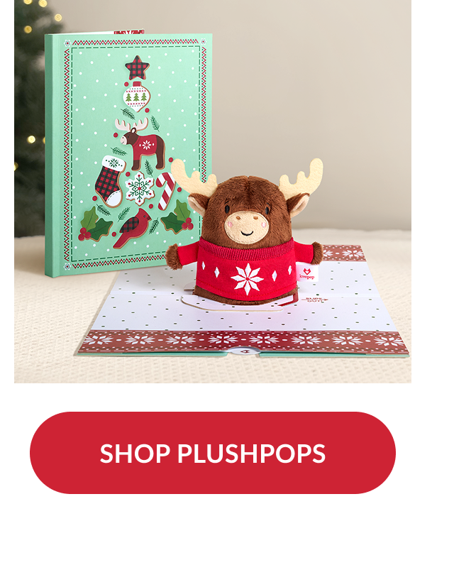 Plush moose wearing red holiday sweater popping up from card with matching mint green box decorated with festive tree design and red button reading shop plushpops