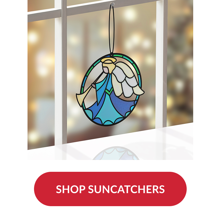 Blue and gold angel suncatcher ornament hanging in a window with blurred holiday lights in background and red button reading shop suncatchers