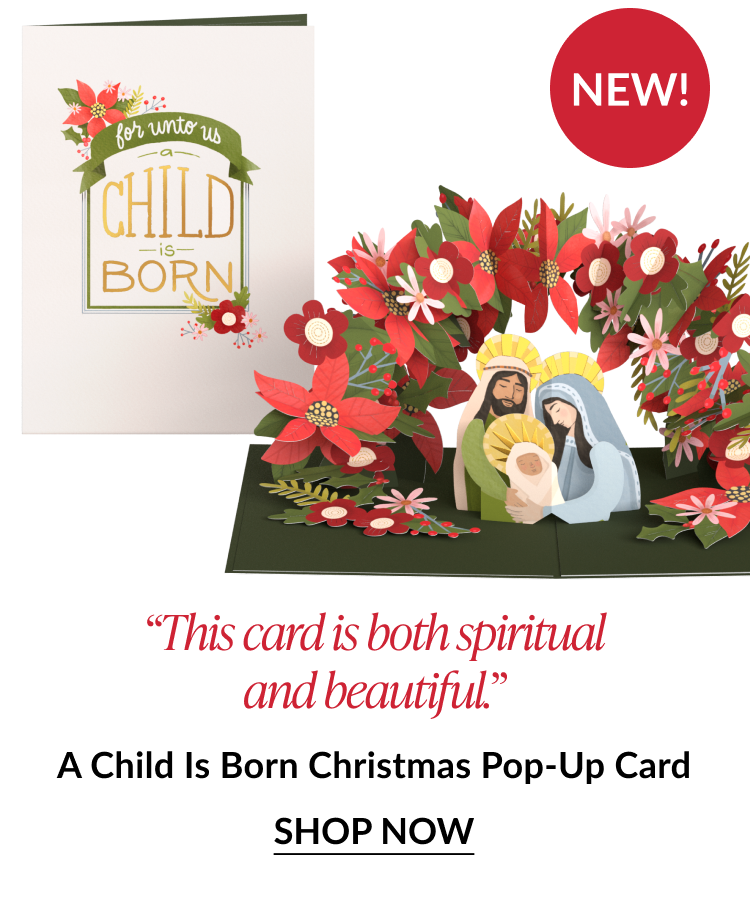 A Child Is Born Christmas pop up card featuring Holy Family surrounded by red and white poinsettias labeled New