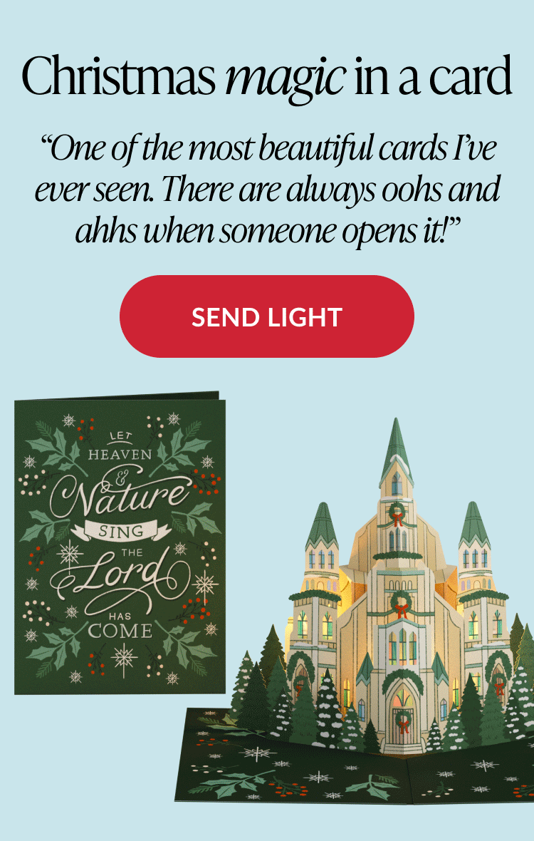 Christmas magic in a card headline with illuminated cathedral pop up card and Send Light button