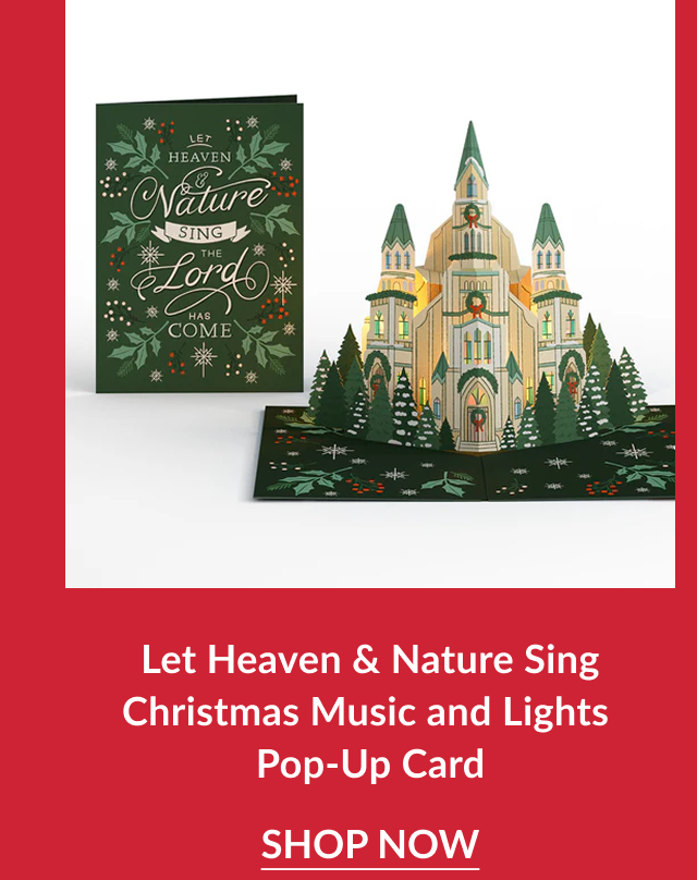 Let Heaven and Nature Sing Christmas Music and Lights Pop-Up Card featuring illuminated cathedral pop-up beside green holly card with shop now button