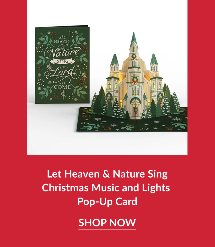 Let Heaven and Nature Sing Christmas Music and Lights Pop-Up Card featuring illuminated cathedral pop-up beside green holly card with shop now button