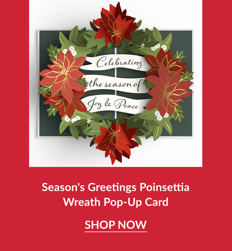 Season’s Greetings Poinsettia Wreath Pop-Up Card featuring red poinsettias and banner reading celebrating the season of joy and peace with shop now button