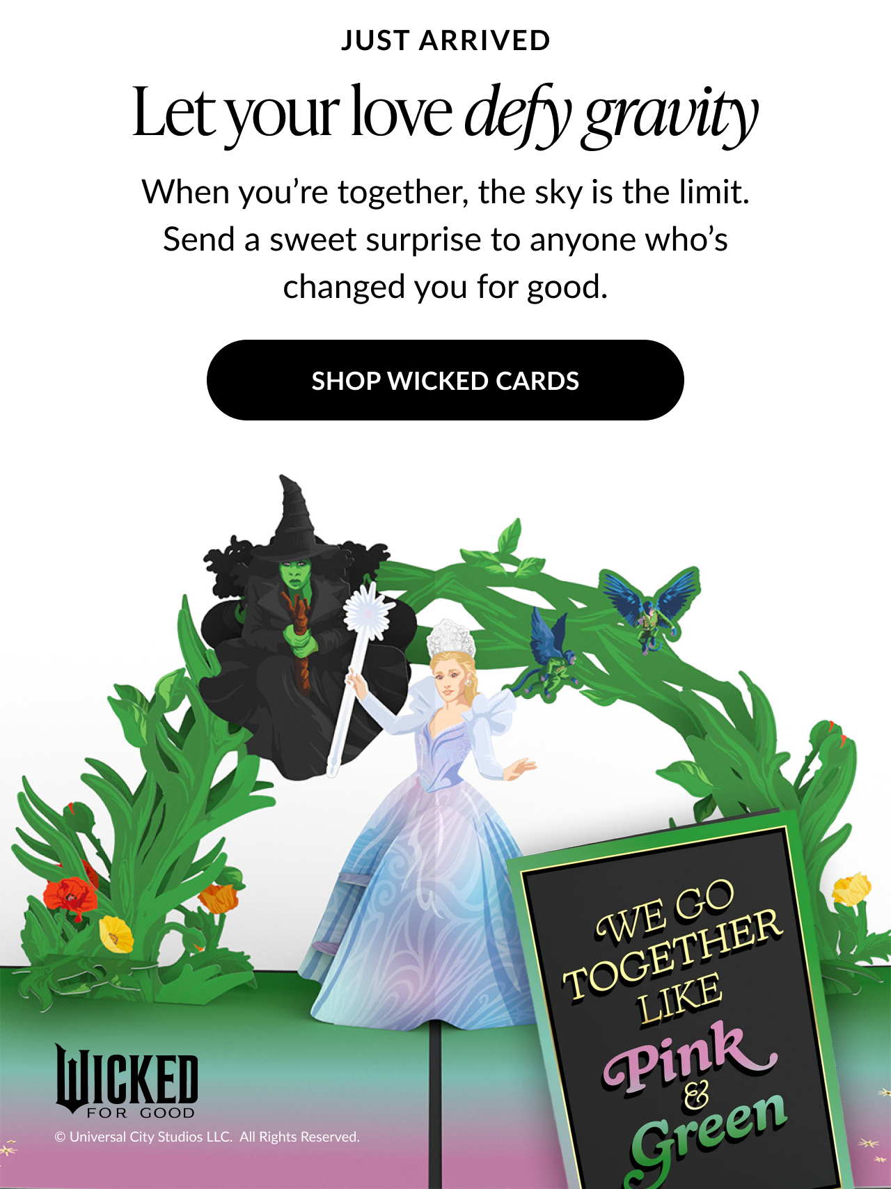Let your love defy gravity Wicked-themed card with Glinda and Elphaba characters in a green arch design