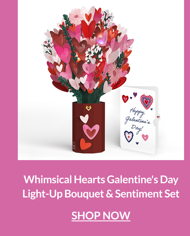 Light-up bouquet of layered pink and red hearts in a vase beside a Galentine’s Day sentiment card.