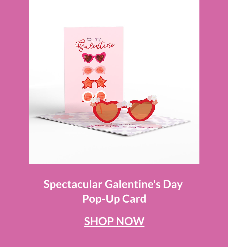 Pop-up Galentine’s card featuring oversized red heart-shaped sunglasses and playful pink graphics inside.