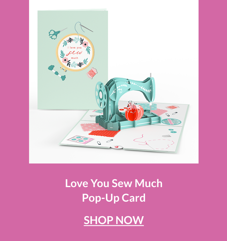 Pop-up card with a teal sewing machine, thread, and heart-shaped fabric details on a crafting-themed base.