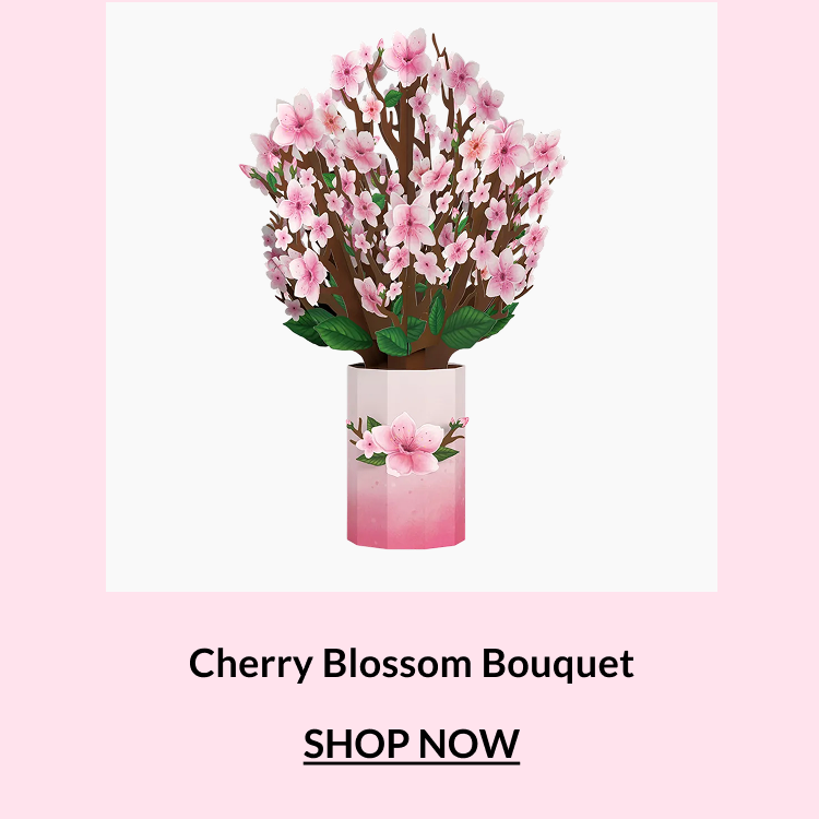 Cherry Blossom bouquet with soft pink blossoms displayed in a decorative vase