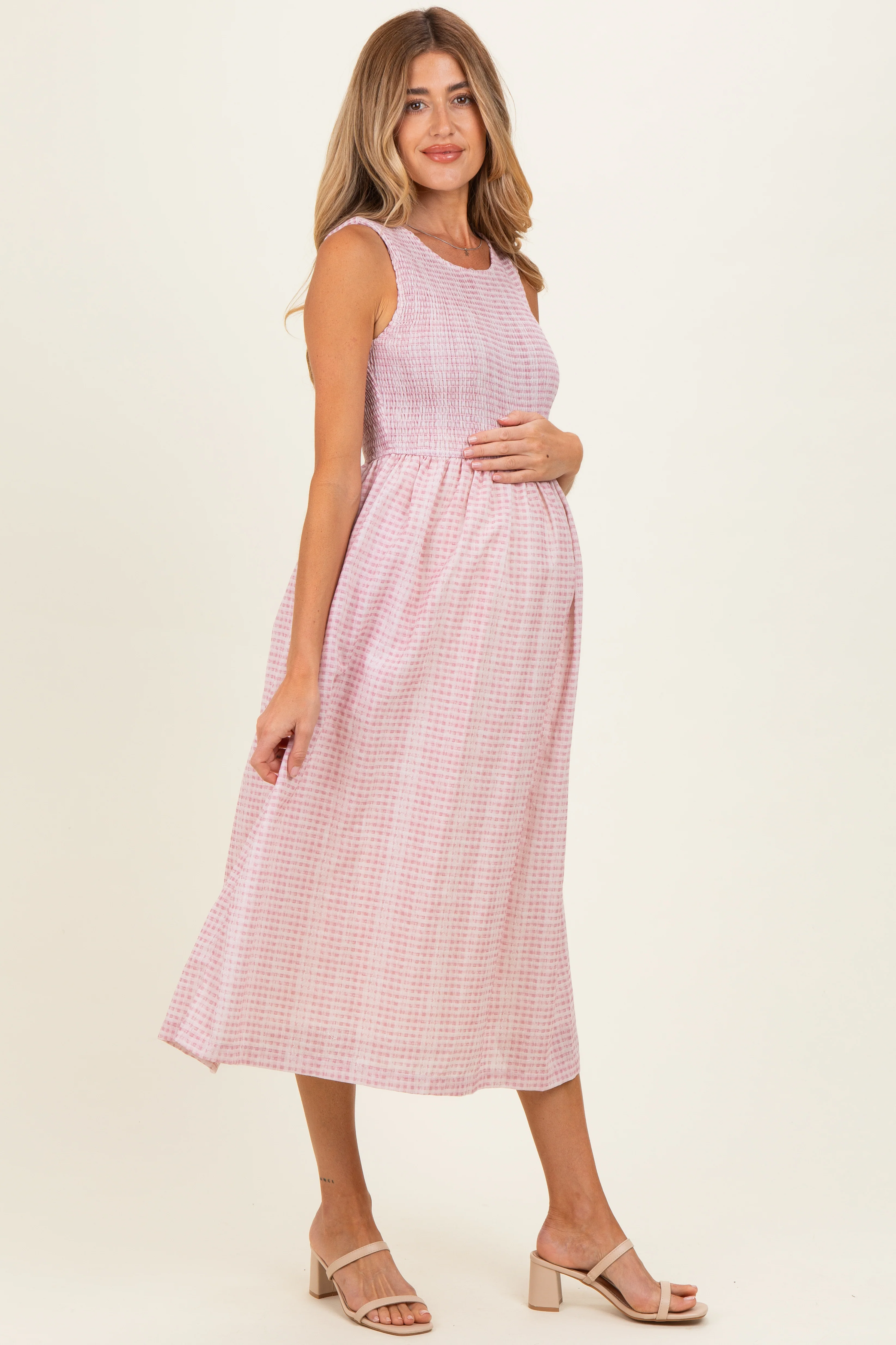 Image of Blush Gingham Sleeveless Smocked Maternity Midi Dress