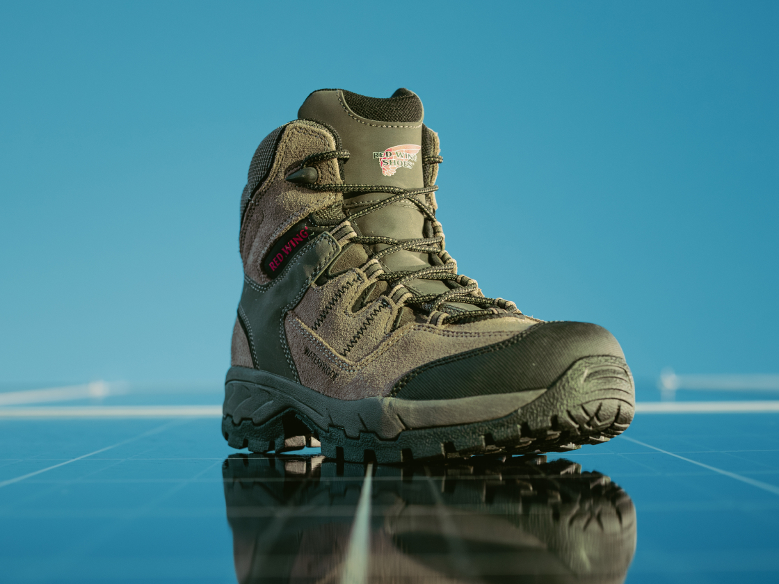 A Red Wing boot on a reflective surface