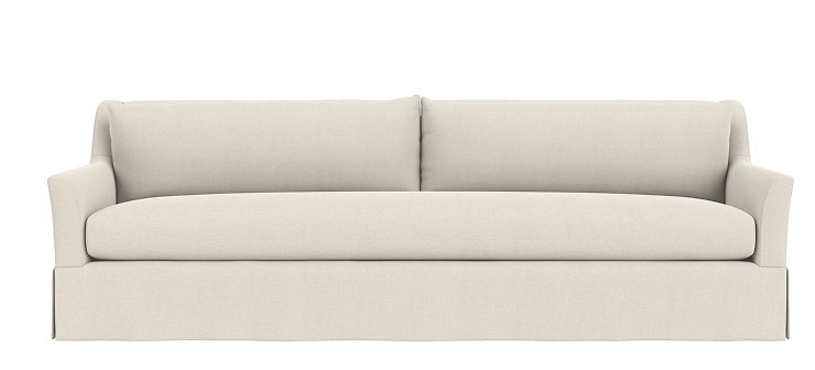 Sybil skirted sofa in Sumner ivory.