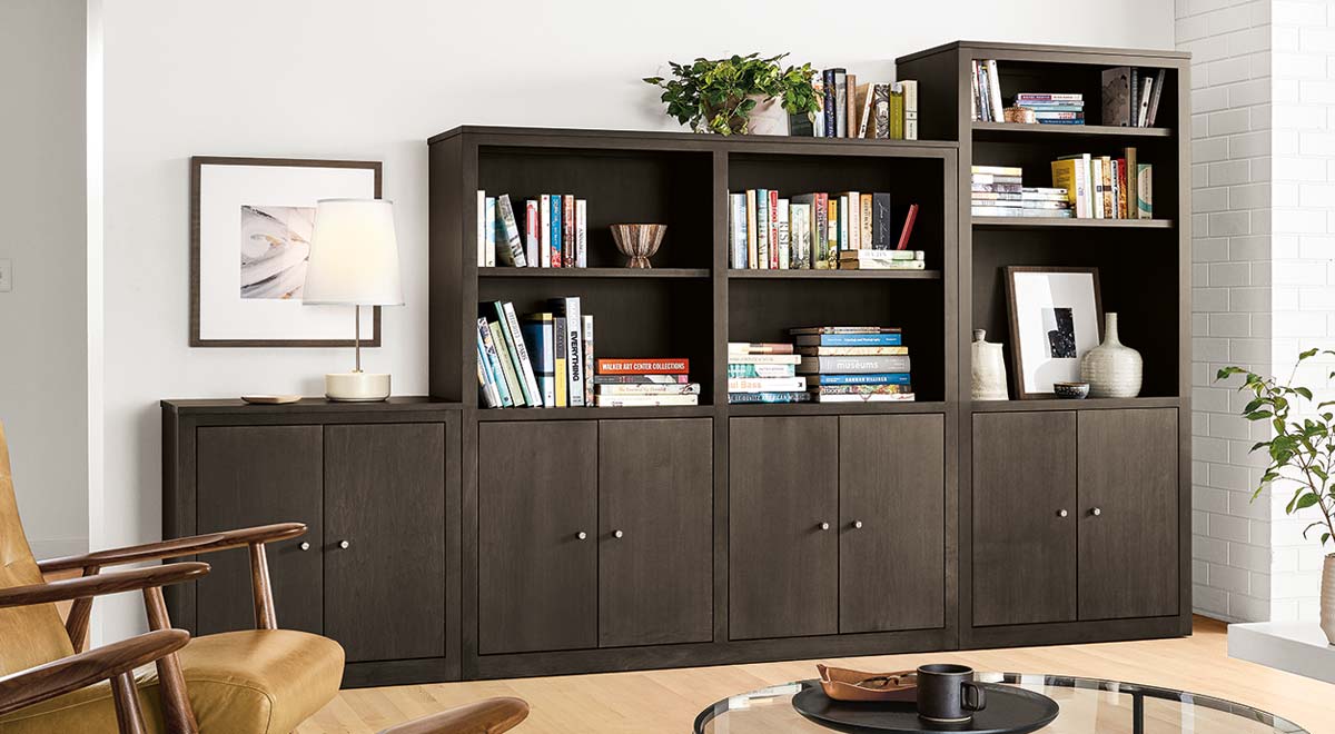 Woodwind custom book case and wall unit storage in a living room.