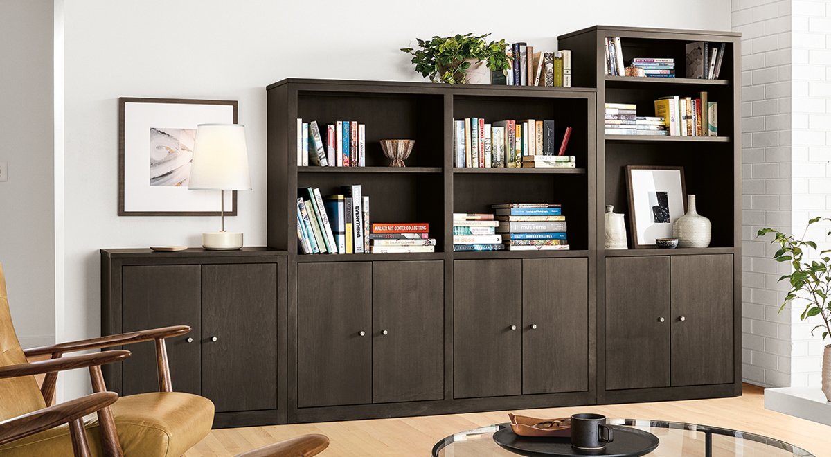 Charcoal Woodwind book case and wall unit storage in a living room.